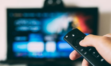 turned-on flat screen television